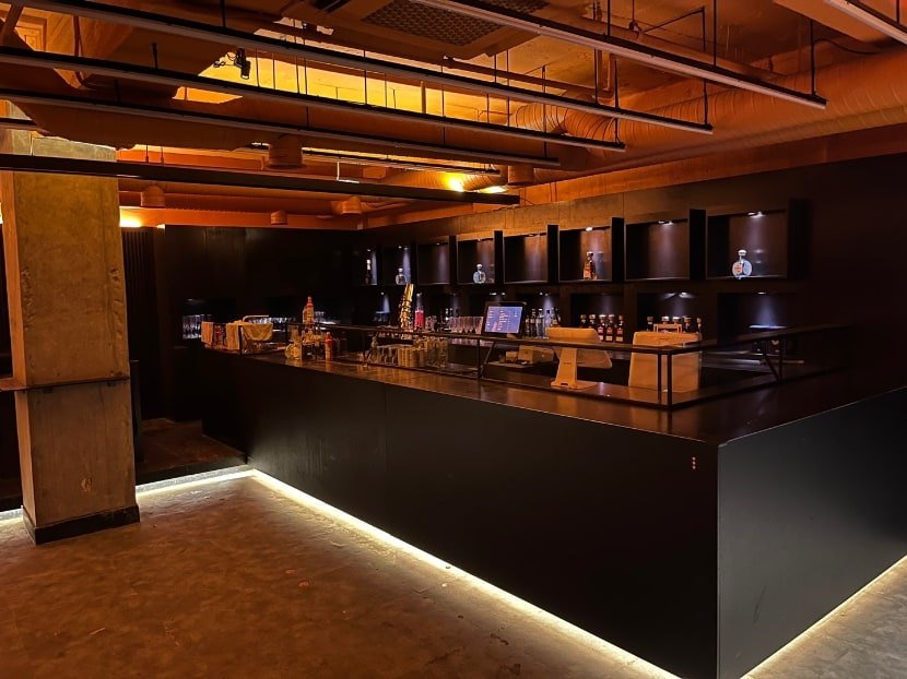 Archive view of TELLER’s empty bar counter and bottle shelves.